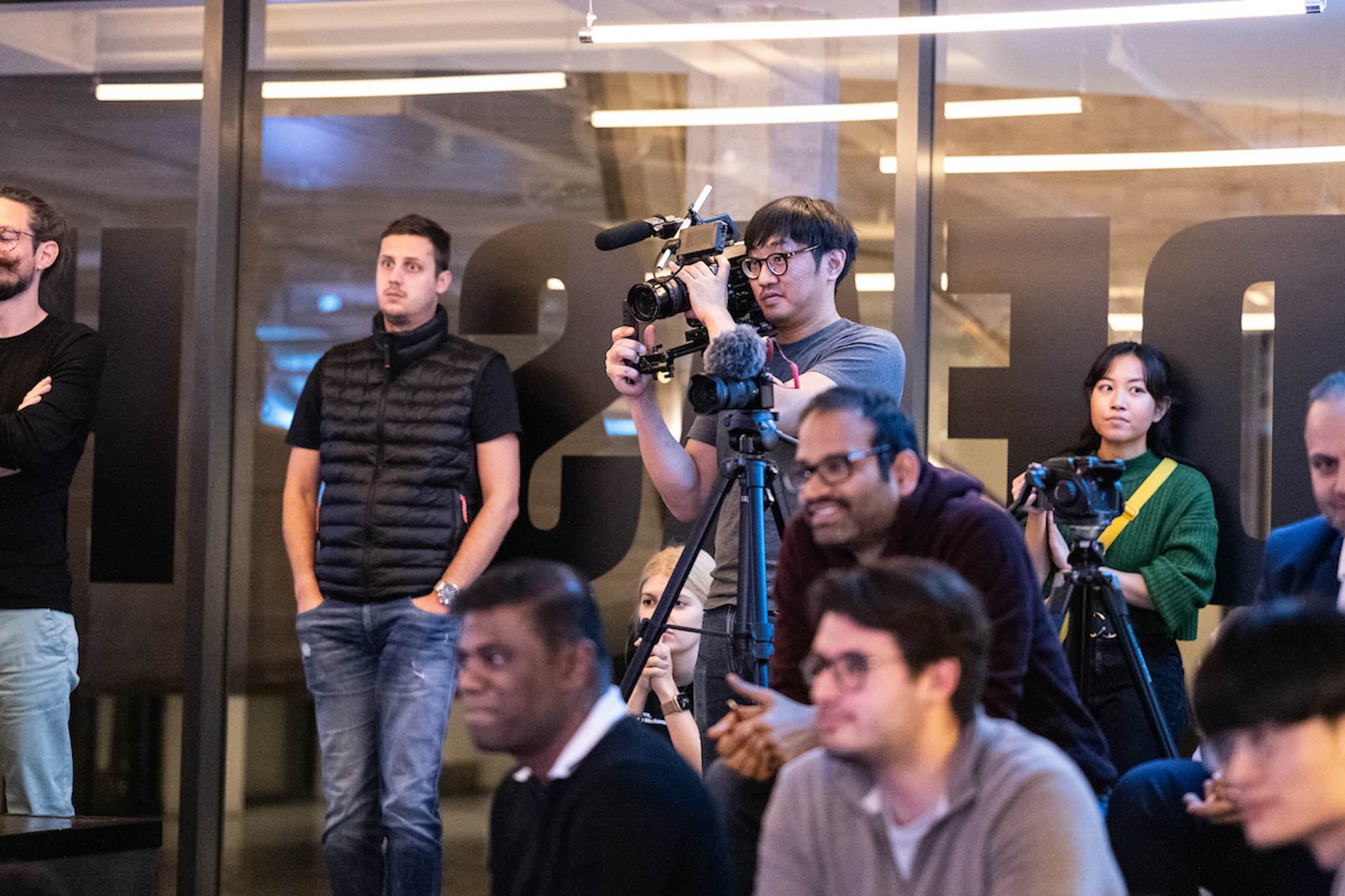 Multiple filming crews including photographers and videographers